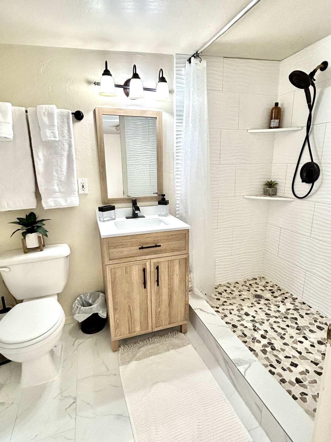 The casita bathroom with vanity, toilet, and walk-in shower