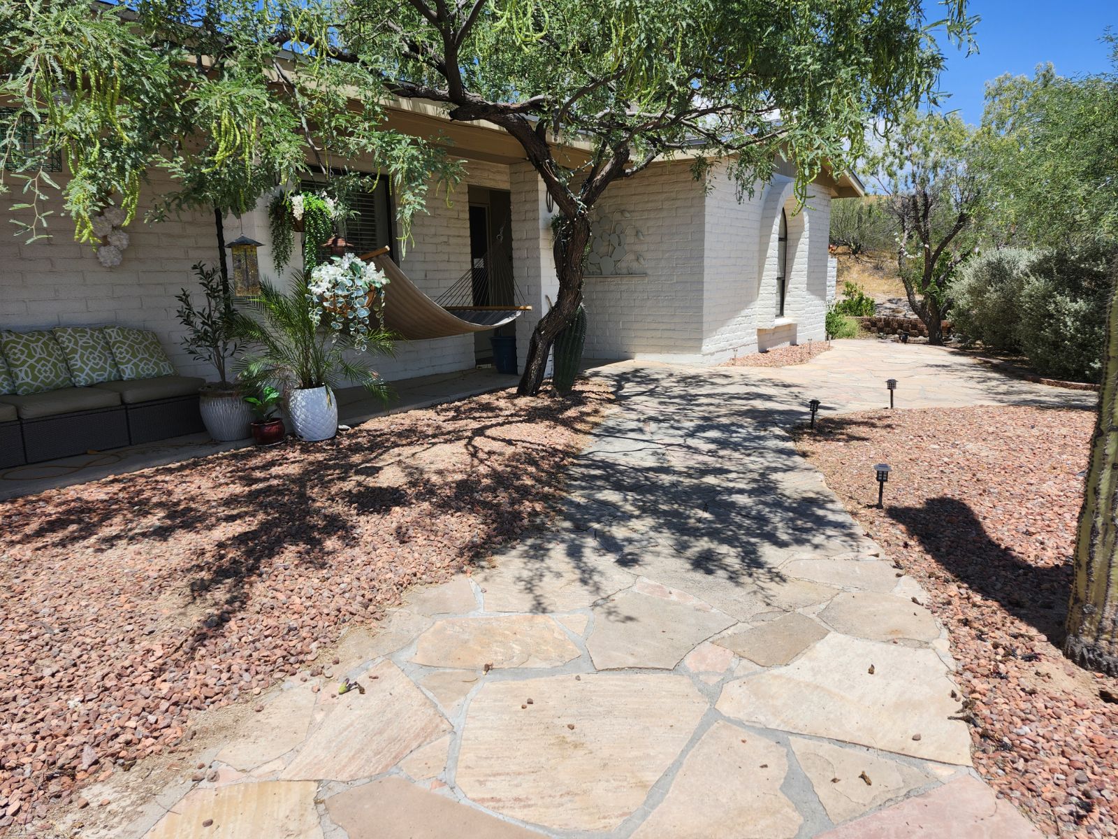 Landscaped stone path leading to the casita entrance